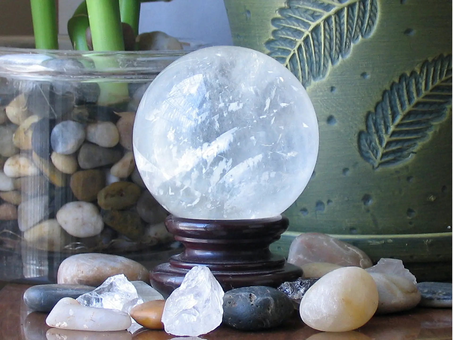 Crystal ball with patterns and small crystals around base